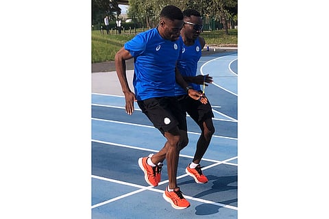 Paris Paralympics 2024: Donard Ndim Nyamjua, left, guide and sprinter Guillaume Junior Atangana